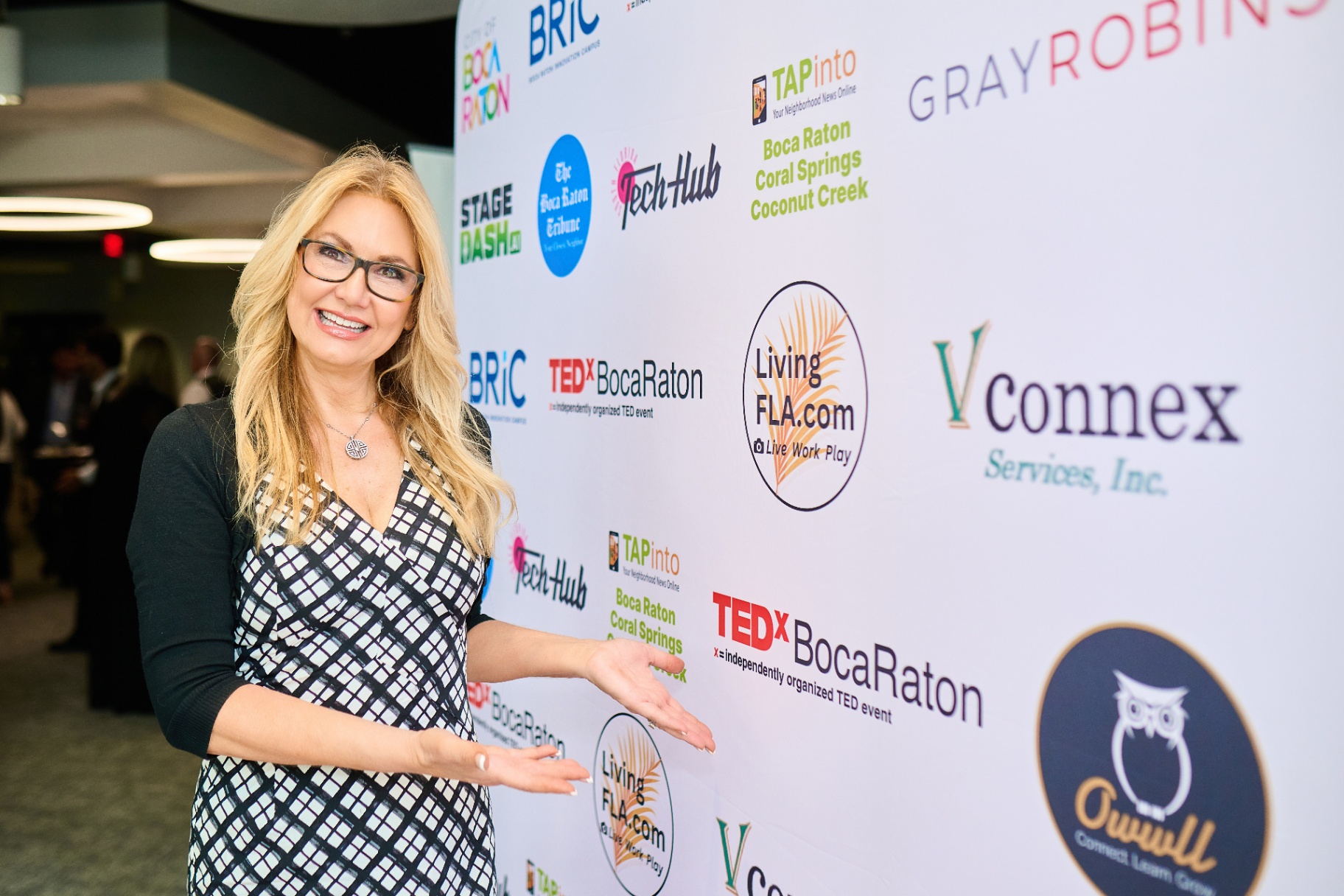 Cindy Metzler at TEDx Boca Raton sponsor wall